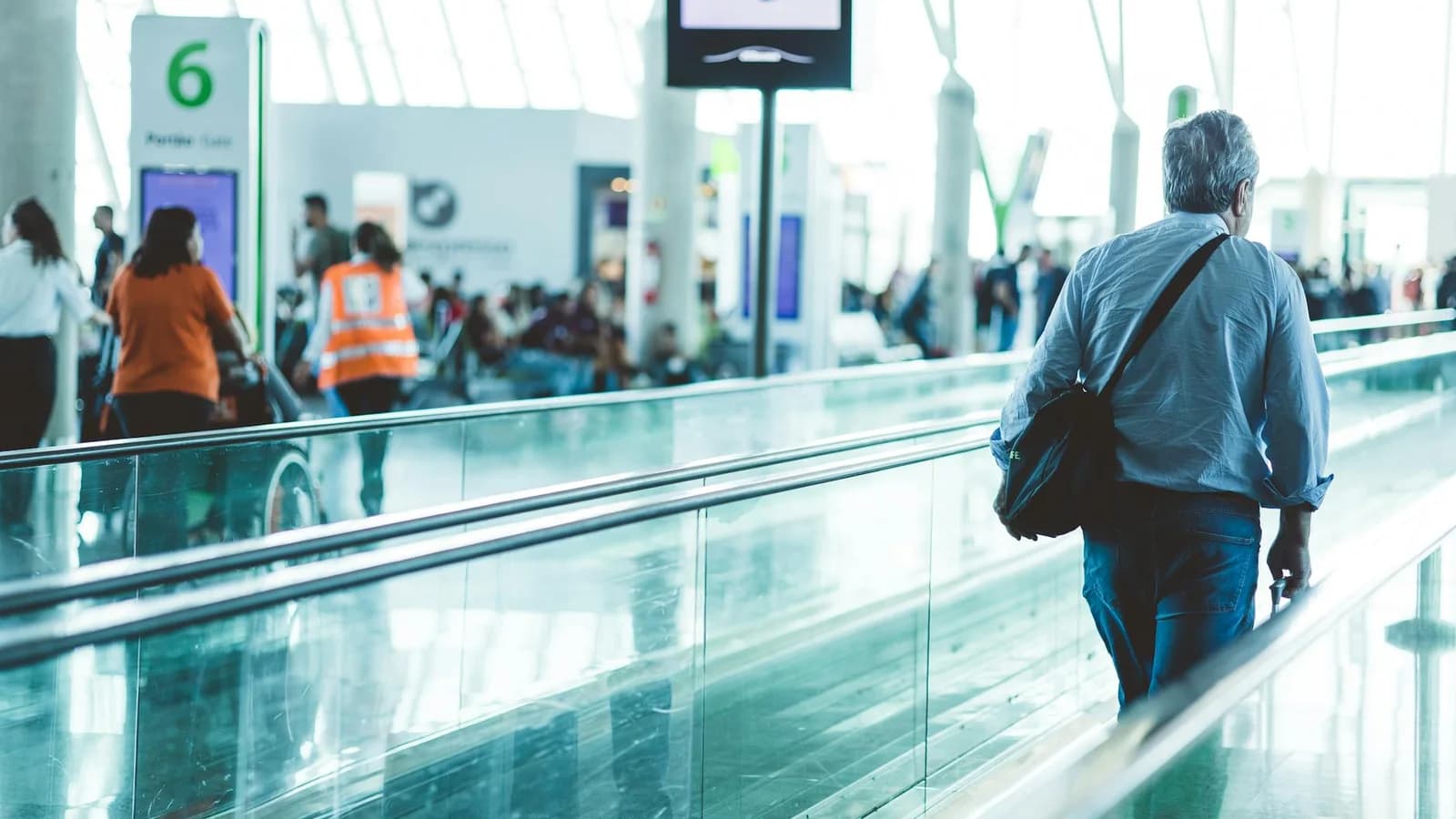 Airport passengers recovering after security before commercial concourse engagement