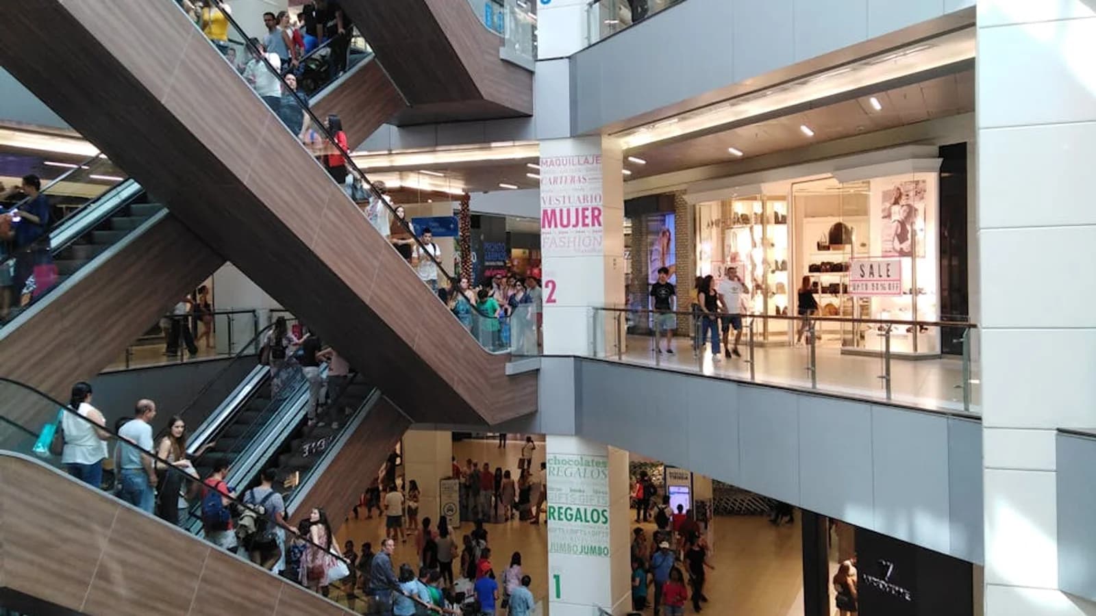 Shopping mall with escalators and multi-level visitor circulation
