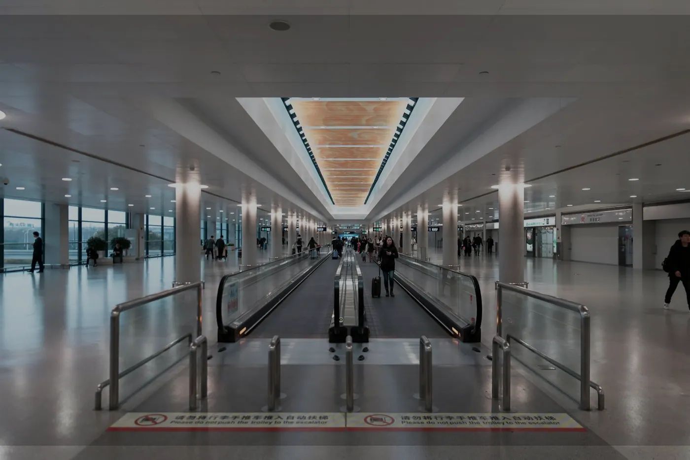 Airport interior with moving walkways and passenger flow