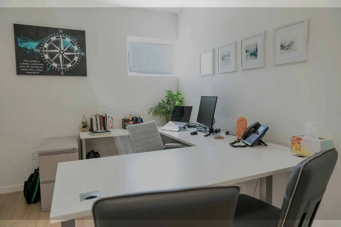 Modern office workspace with desk, computer and decor