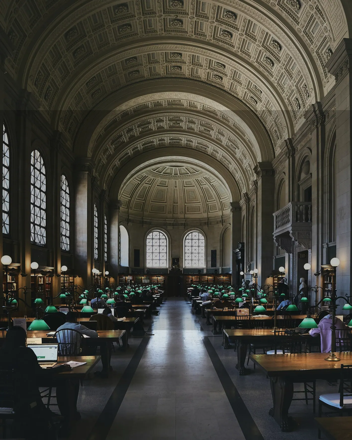 Large library interior with study desks and readers