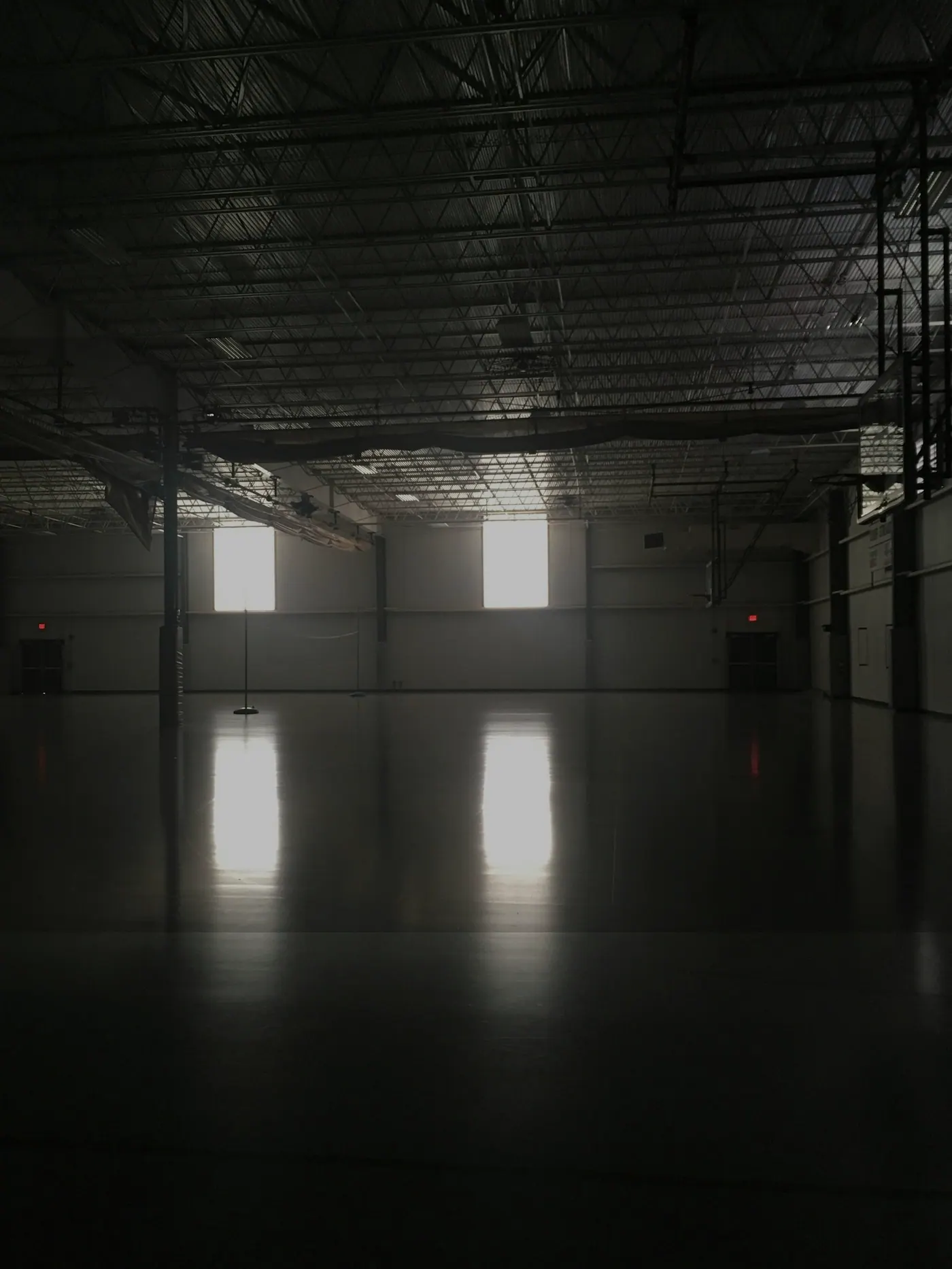 Warehouse interior with large floor area and industrial lighting